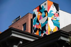 CommUNITY mural by Ruben Sanchez at the '68 apartments